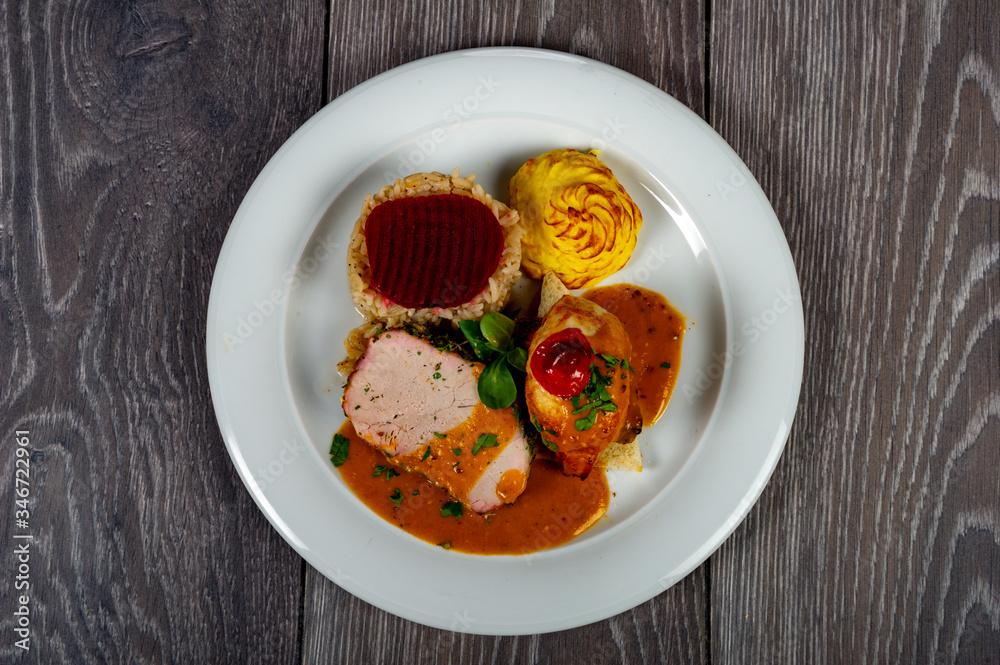 lunch with meat roll with vegetables and sauces and beets