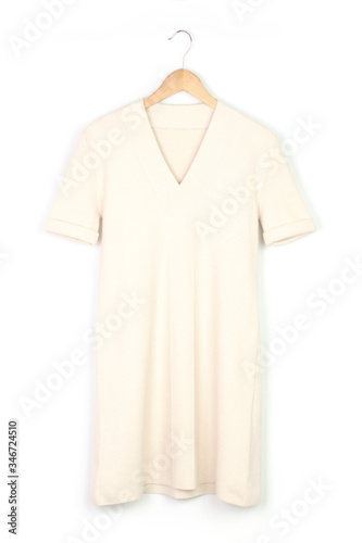 milk knitted dress on the hanger isolated on white, front and back