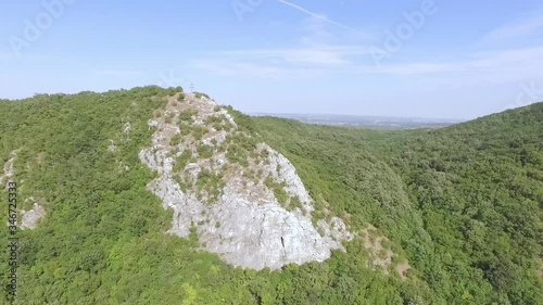 Aerial drone flight over green hill, opening beautiful panorama view at green valley with hills, mountains. Hungary, Europe 4K photo