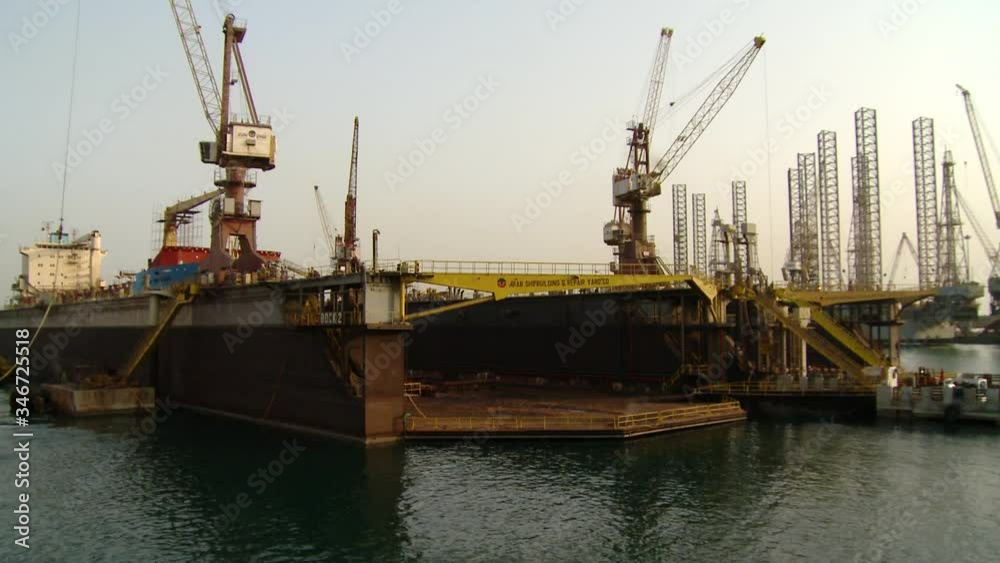 A one-minute day to night timelapse of an active dry dock in Bahrain A one-minute day to night timelapse of an active dry dock in Bahrain