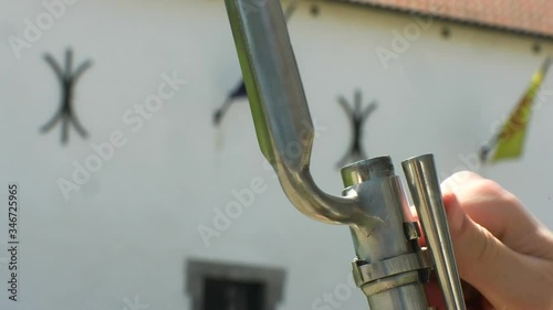 Preparing and charging a musket. Gun, rifle. Close.