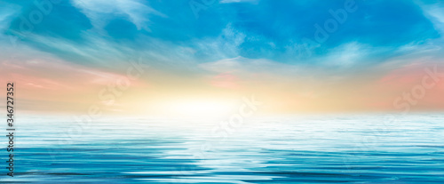 Seascape  horizon with sunset. Reflection of light in the water. Empty landscape. Abstraction  nature  sea waves. Natural background.