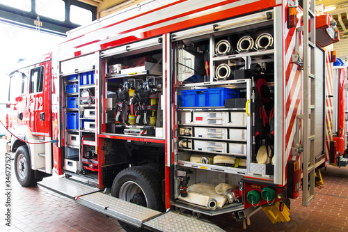 Firefighting equipment in a fire truck with the vehicle garage open at the main police station