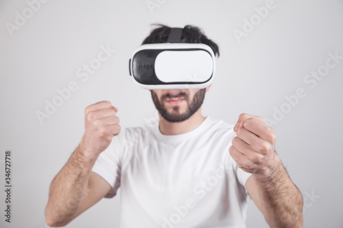 Man wearing VR goggles. Fight in virtual game