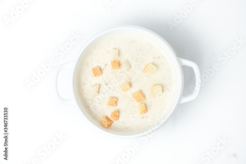 food soup in a white plate on a white background