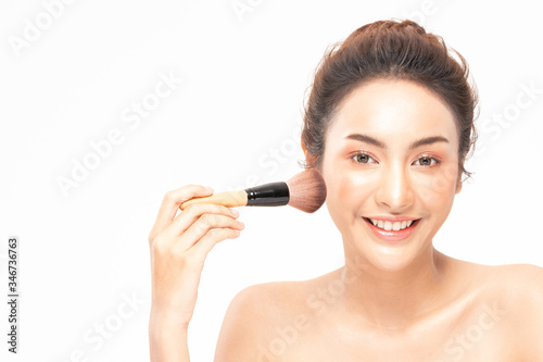 Beauty asian woman brown hair looking smile in camera happiness and hold make up brush and cheerful with make up brush,Beauty Concept on white background.