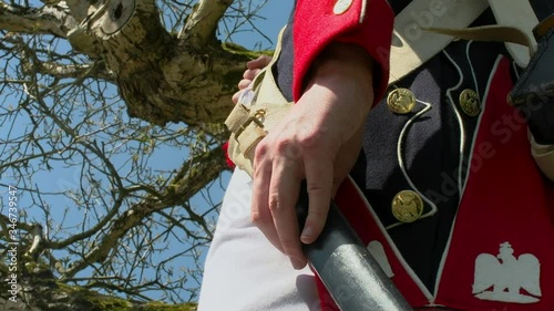 French Napoleon soldier sticks his sword in the holster. Battle of Waterloo. photo