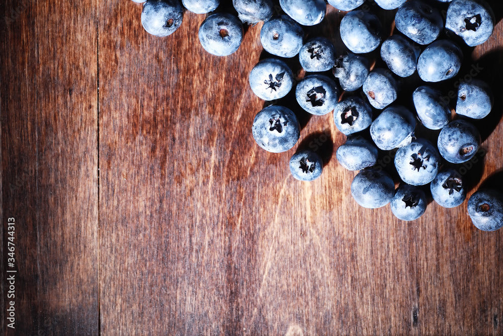 Water drops on ripe sweet blueberry. Fresh blueberries background with copy space for your text. Vegan and vegetarian concept. Macro texture of blueberry berries. Water drops on ripe sweet blueberry. Fresh blueberries background with copy space for your text. Vegan and vegetarian concept. Macro texture of blueberry berries.