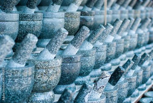 Stone mortars lined up in front of the Angsila shop. Chonburi Province photo