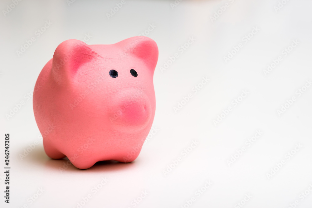 Pink piggy Bank On a white background. The concept of savings, financial management.