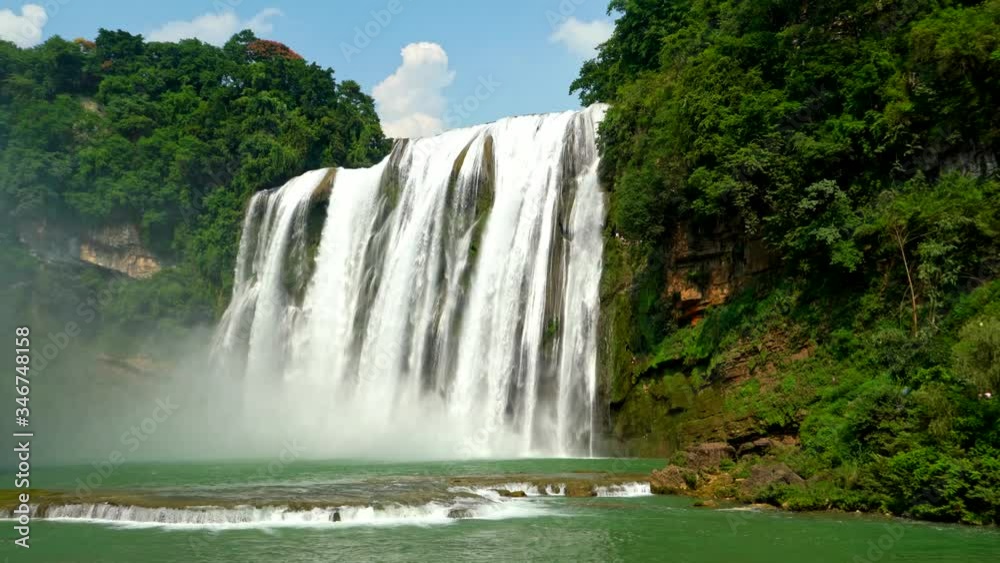 Chinese summer waterfall landscape, waterscape among mountains Chinese summer waterfall landscape, waterscape among mountains