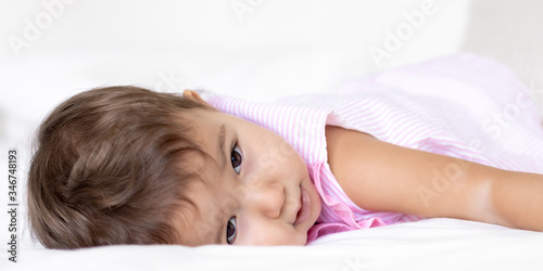 portraits of a baby in bed