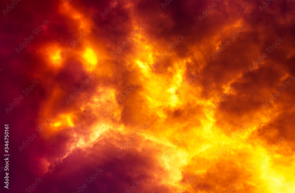 Flame are burning on clouds in dark red sky