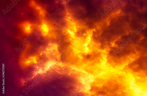 Flame are burning on clouds in dark red sky