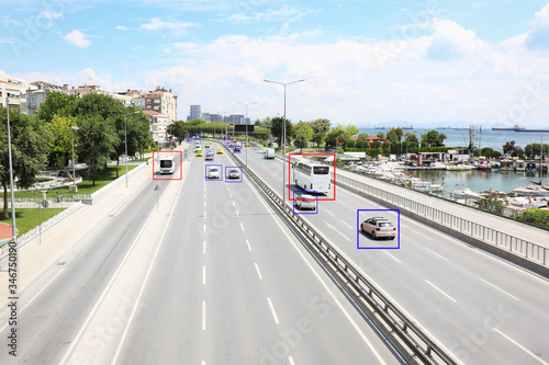 City road with scanner frames on cars near sea. Machine learning © New Africa
