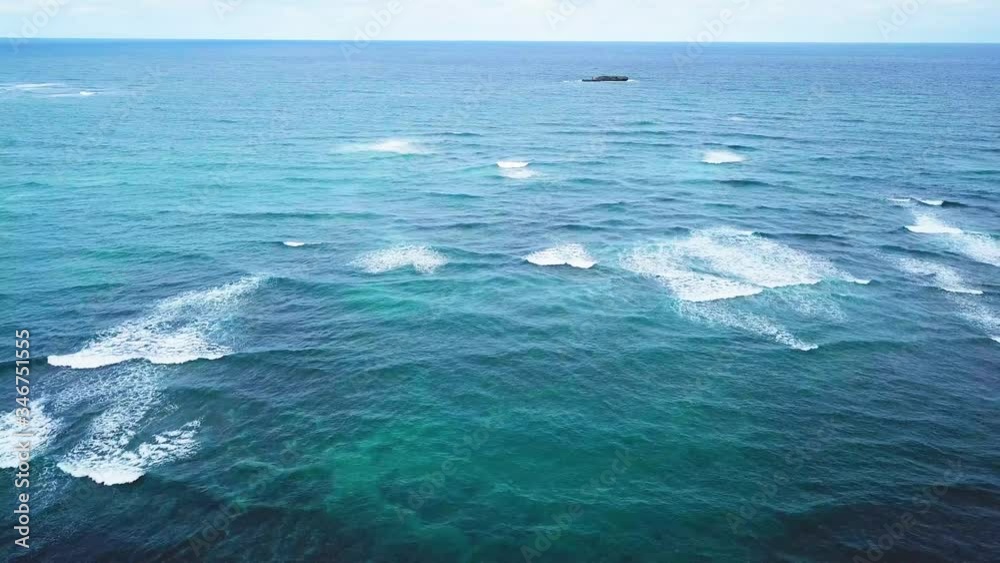 Aerial view of waves, track right, off the coast on Oahu, Hawaii Aerial view of waves, track right, off the coast on Oahu, Hawaii