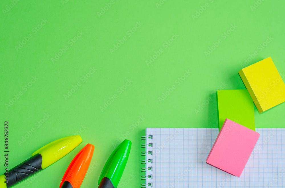 Back to school concept. School and office supplies on office table, green background. Flat lay with copy space. Back to school concept. School and office supplies on office table, green background. Flat lay with copy space.