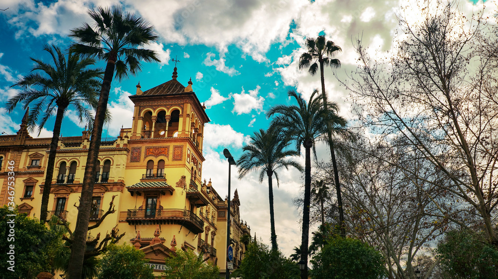 Seville, Spain - 10 February 2020 : Architecture with Palm Trees in Seville Spain City Center
