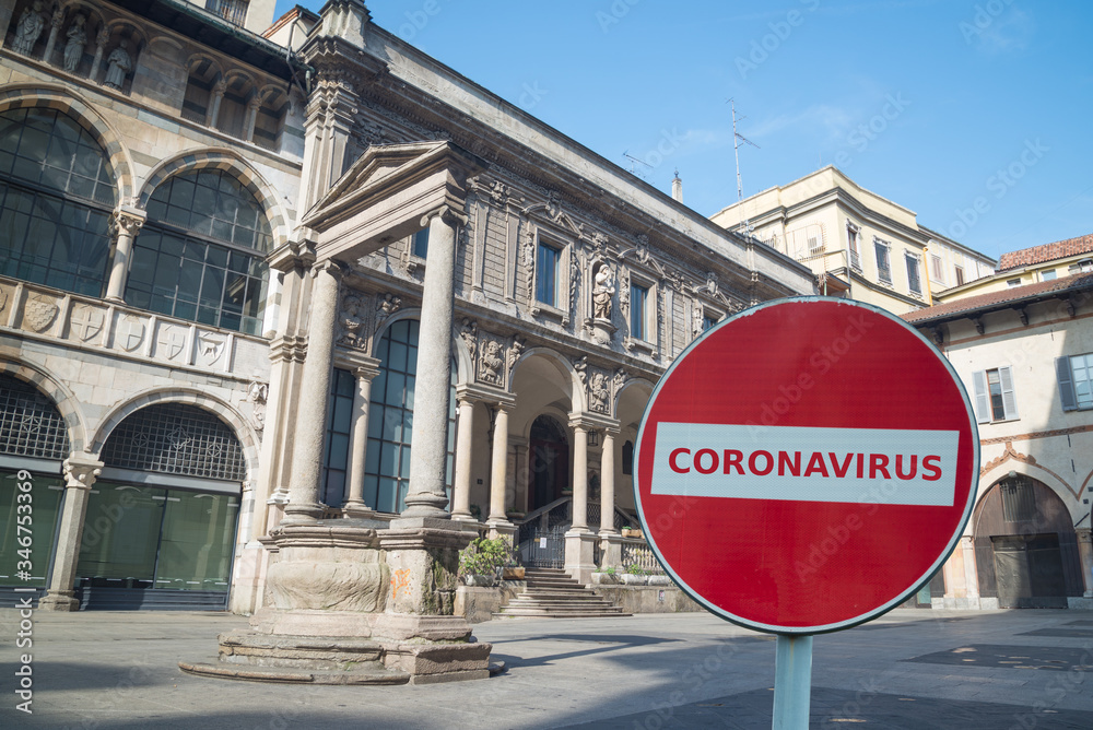 Coronavirus no-entry sign in front of the famous Mercanti Square in Milan, Italy