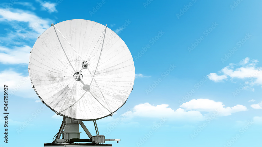 satellite antenna isolated on blue sky background Front view of modern radio communication equipment Digital tv broadcast signal receiving system wide copy space design backdrop