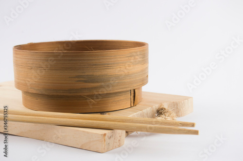 Bamboo dimsum klakat is a food steamer made from bamboo. Flat Lay decoration with white space background.