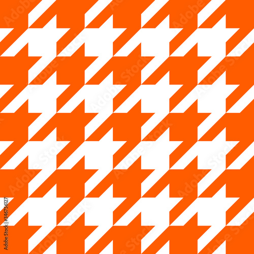 Goose foot. Pattern of crow's feet in orange and white cage. Glen plaid. Houndstooth tartan tweed. Dogs tooth. Scottish checkered background. Seamless fabric texture. Vector illustration