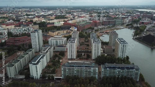 4K Helsinki Baltic Sea Finnish Bay lagoon, yachts view on cloudy summer day aerial video, Merihaka area, Tervasaari Island green park in Finland capital Suomi, northern Europe photo