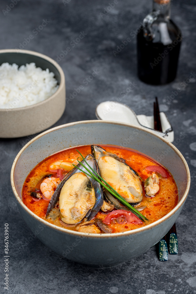 Tom yum soup with seafood rice in the decor Tom yum soup with seafood rice in the decor