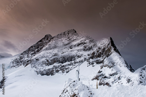 The Top Of Jungfraujoch Mountain In Switzerland. Jungfraujoch Is A Saddle In The Bernese Alps That Connecting The Two Four Thousander Peaks Jungfrau And Mönch photo