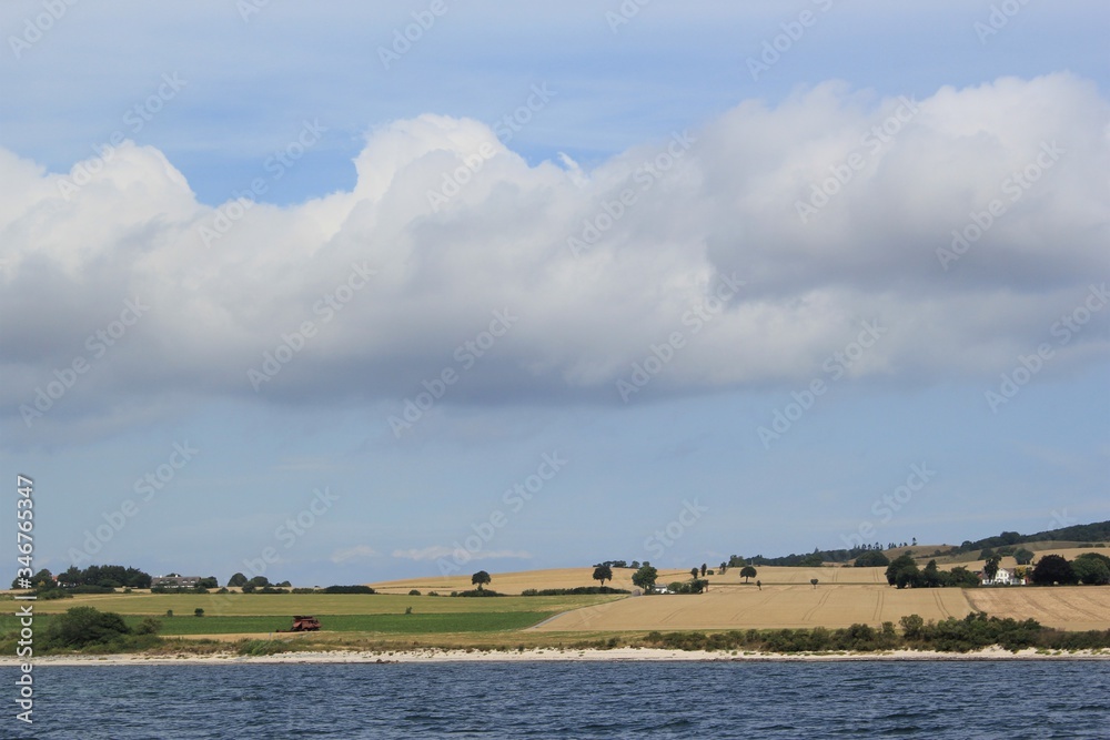Landscape with clouds on the coast of Denmark