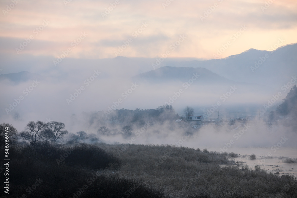 Winter morning scenery of water misty rivers and mountains. Soyang River, Chuncheon City, Korea