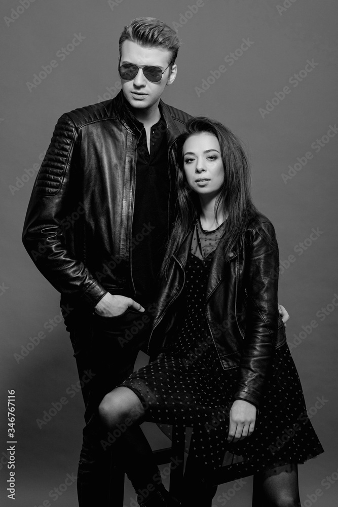 cool man and woman on gray background