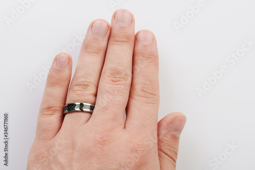Black ring on man hand