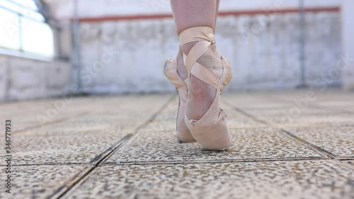Ballerina trying to stand on tiptoe ballet