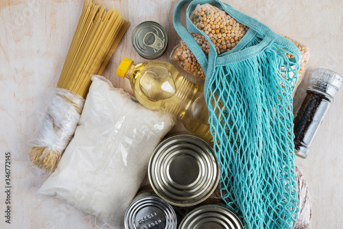 String bag in blue and food donation products.