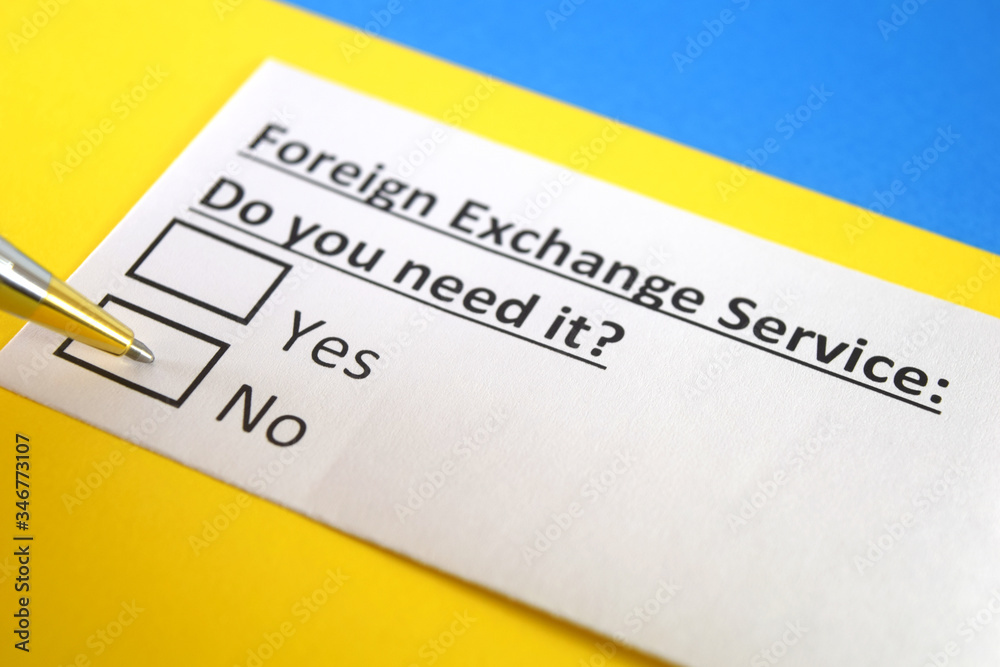 One person is answering question about foreign exchange service. One person is answering question about foreign exchange service.
