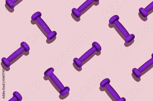 Color picture, home training. Sports pattern. Purple dumbbells scattered on a pink background. © Aleksandra Abramova