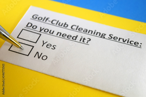 One person is answering question about golf club cleaning service.