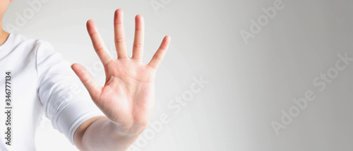 Wallpaper Mural Close-up of a hand palm showing five fingers; the hand signs telling to stop and warning to do not do something. Torontodigital.ca