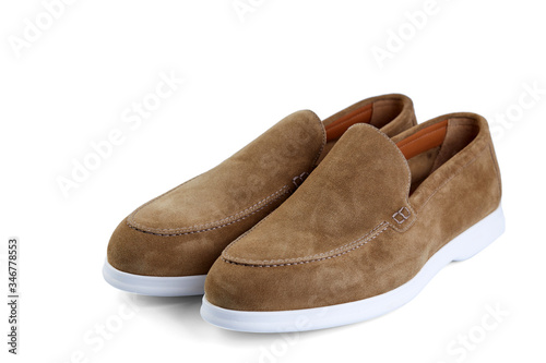 Men's elegant beige suede shoes on white rubber sole. Top view at an angle.