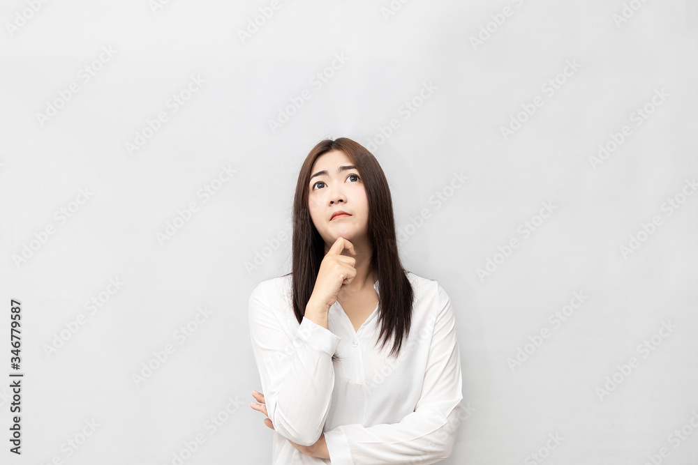 Long-haired Asian women are standing thinking Long-haired Asian women are standing thinking