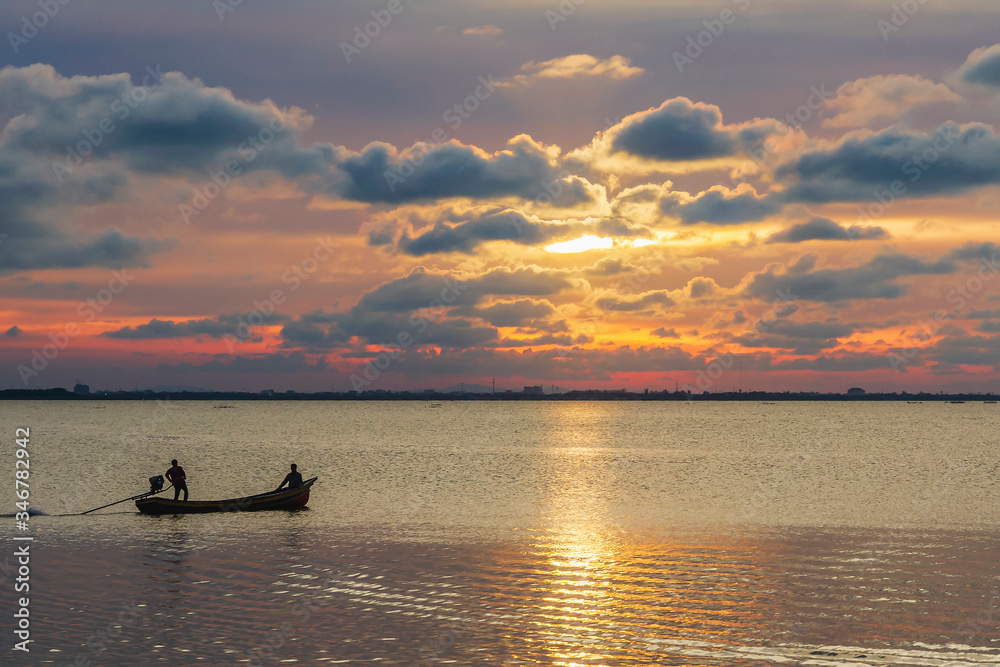 Silhouette of a local fishing boat at the sea in Yaring District, Pattani, Thailand