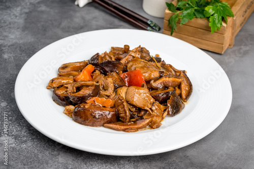 Chinese shiitake mushrooms stewed with meat in a white plate