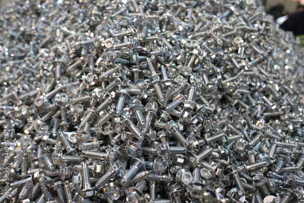 the raw material of the screw and machine producing bolts at the factory the raw material of the screw and machine producing bolts at the factory