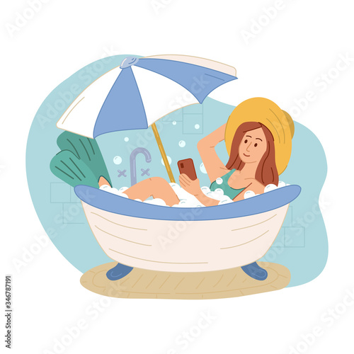 Girl imitating oversea vacation on beach in bathtub in bathroom at home during quarantine. Woman in swimsuit and hat. Coronavirus situation in tourism industry. Quarantine. Stay at home. Isolation.