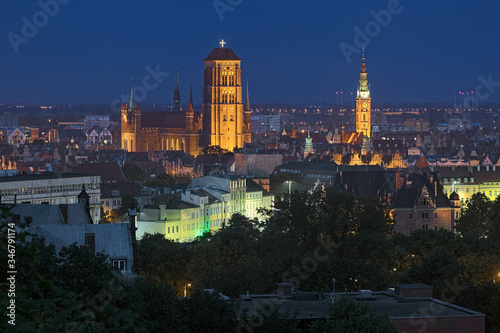 Gdansk, Poland. St. Mary's Church and tower of Main Town Hall in dusk. View from Gradowa Hill.