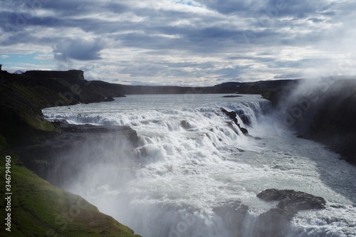 Waterfall with cloudy skies in Iceland