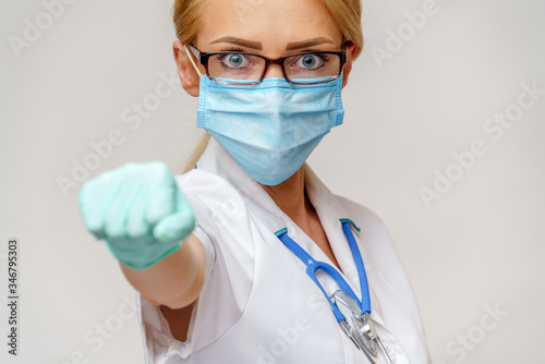medical doctor nurse woman with stethoscope wearing protective mask