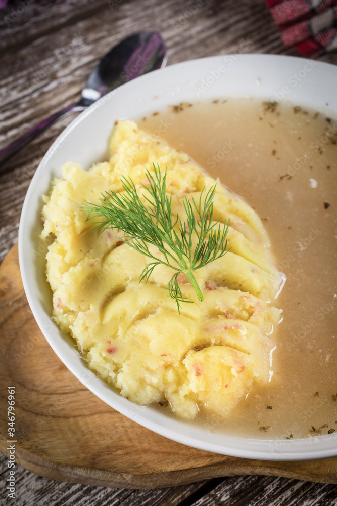 Pure white borscht served with mashed potatoes. Pure white borscht served with mashed potatoes.