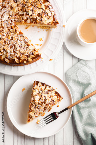 Sponge almond and lemon cake with a coffee photo